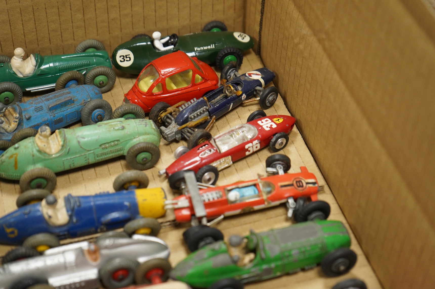Twenty-eight diecast and tinplate vehicles by Dinky Toys, Schuco, Crescent, Corgi Toys, etc., including a good selection of single seat racing cars, three Schuco telesteering cars, etc.